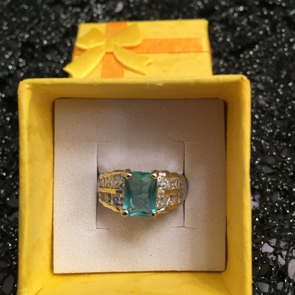 Aquamarine with cz’s set in sterling Silver.